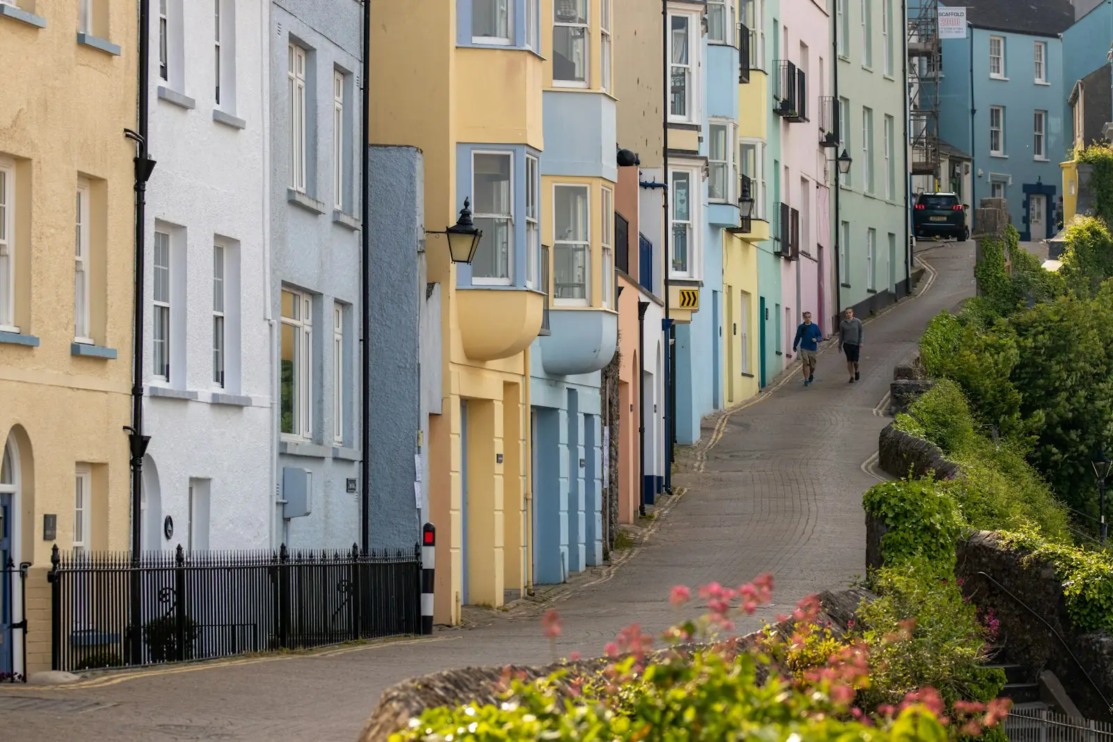 Steep street of colourful painted houses in a seaside town