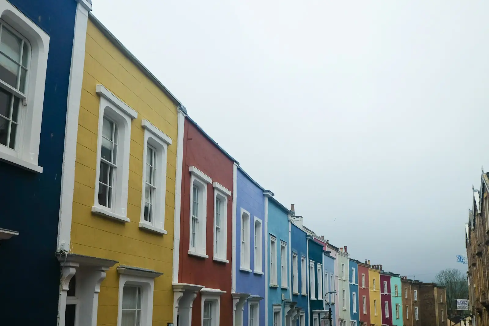 Terrace of houses painted in bold blue, yellow and red