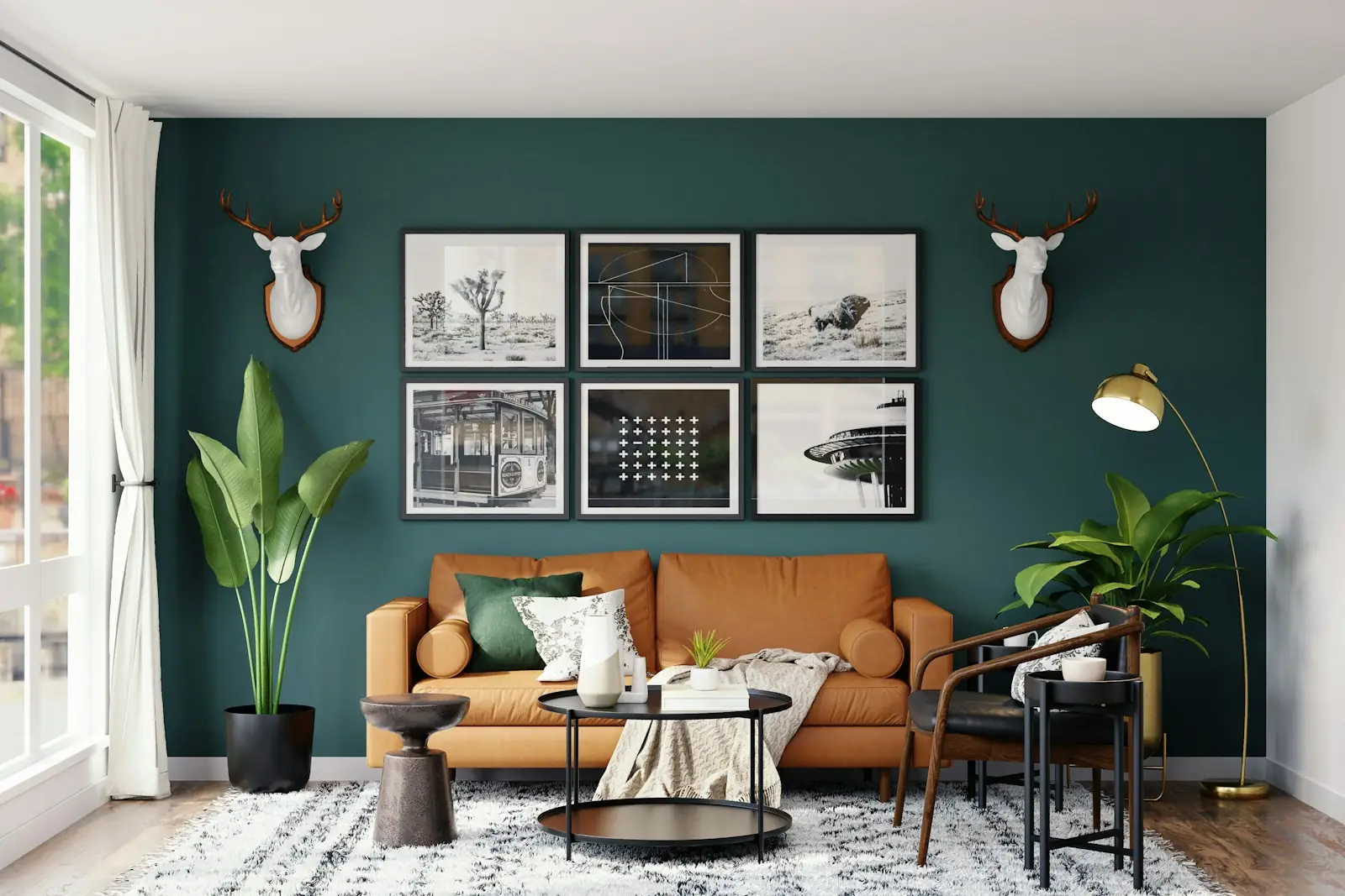 Living room with a dark green painted feature wall and framed prints