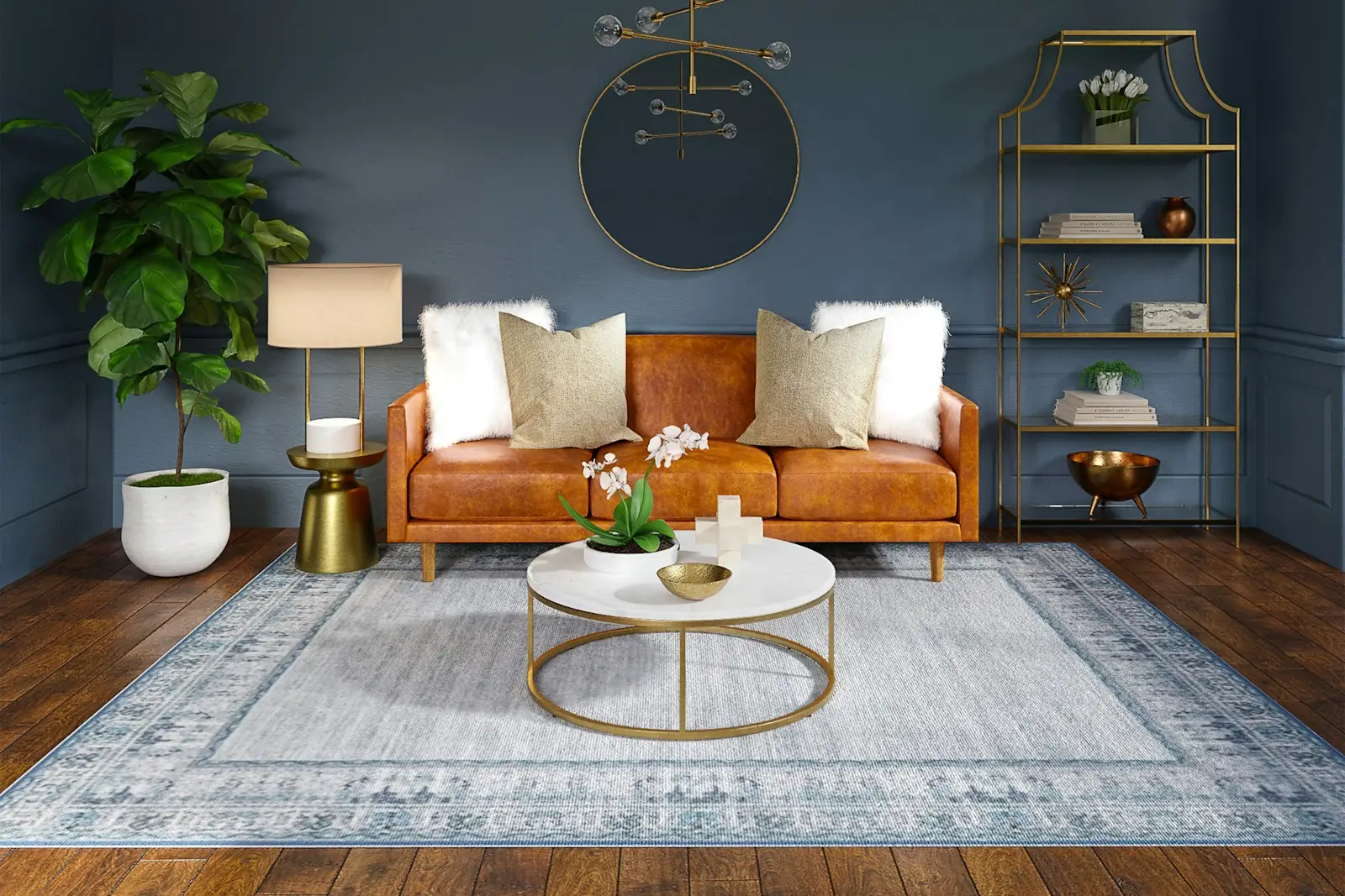 Living room painted in deep navy with a tan sofa