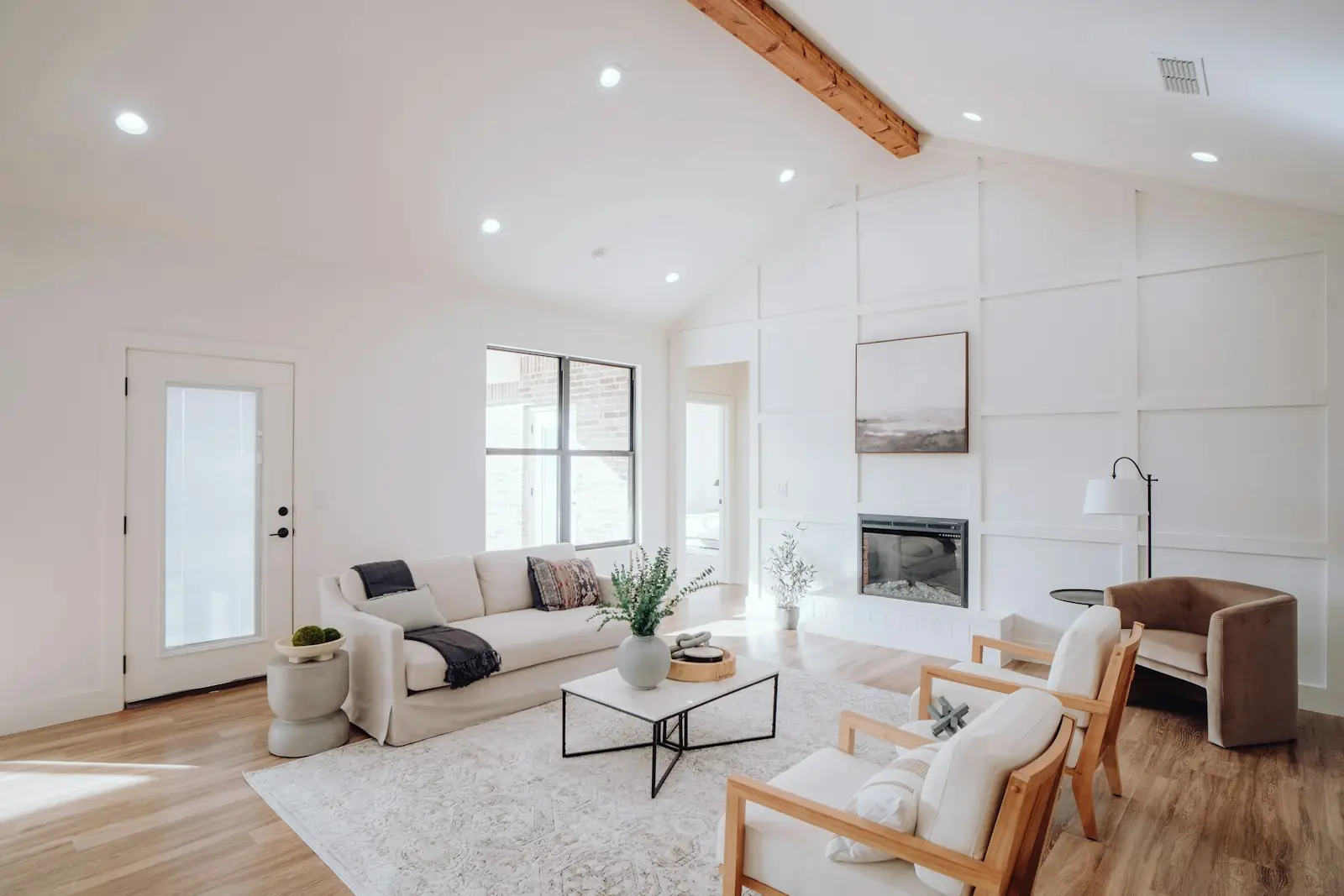 Bright living room with white painted walls and a high ceiling